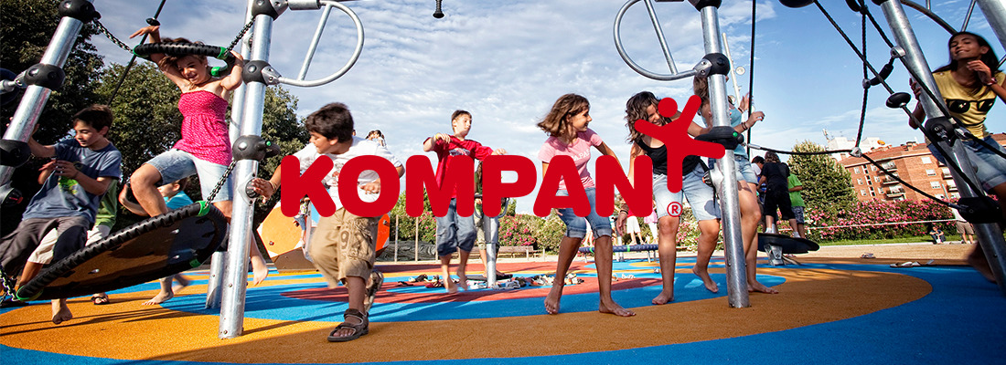 Kompan logo over top of kids playing in a park