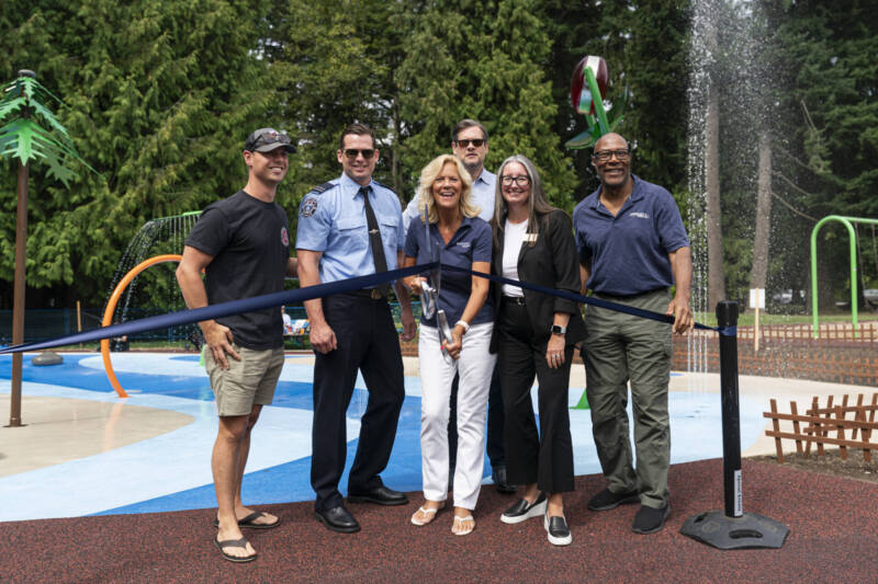 Community members participating in the ribbon cutting of the new Generations Playground Splash Pad in White Rock, BC