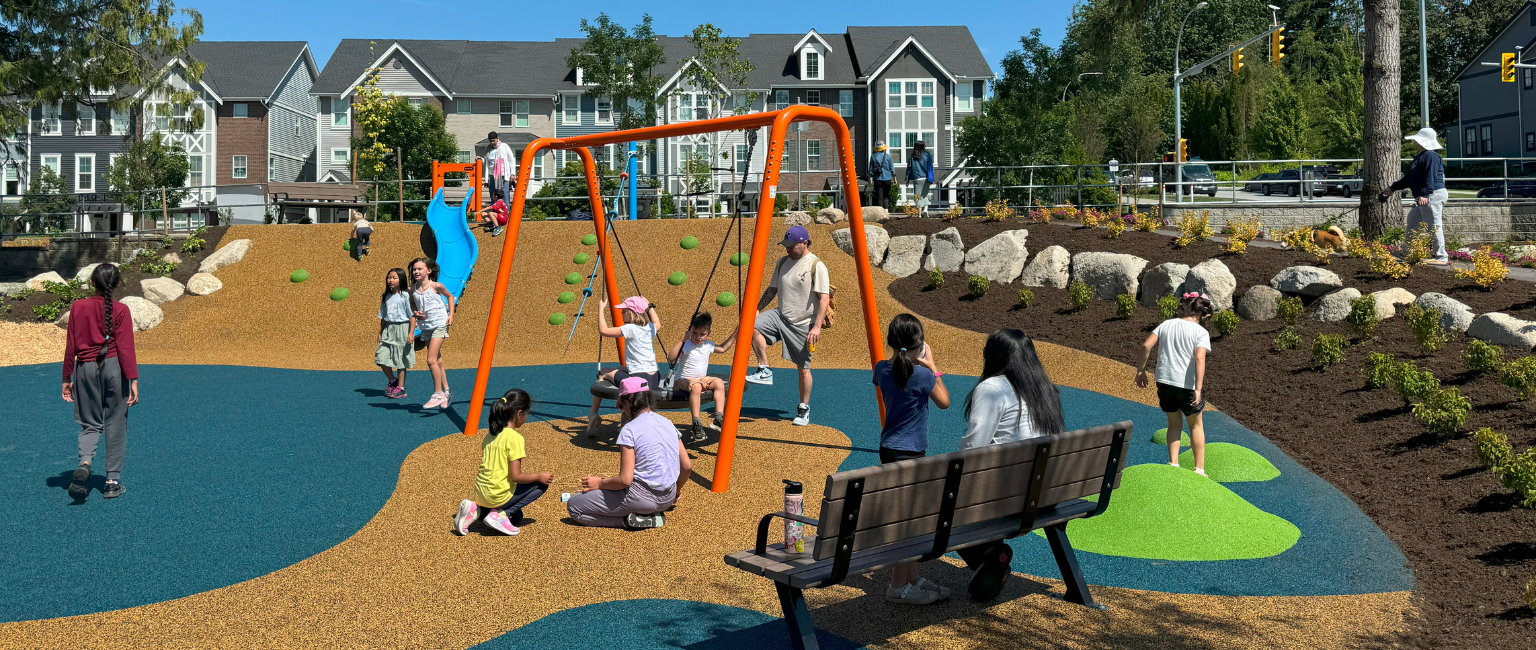 Community playground with lots of variety and seating for parents and guardians