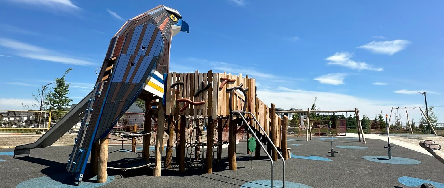 Osprey bird themed playground structure at a neighbourhood park in Calgary, AB